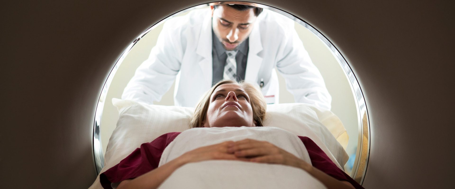 Doctor and patient with CAT Scan Machine